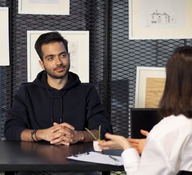 Man at a desk in an interview
